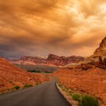 Scenic Drive at Capitol Reef National Park under dramatic wildfire smoke during a summer road trip in Utah.