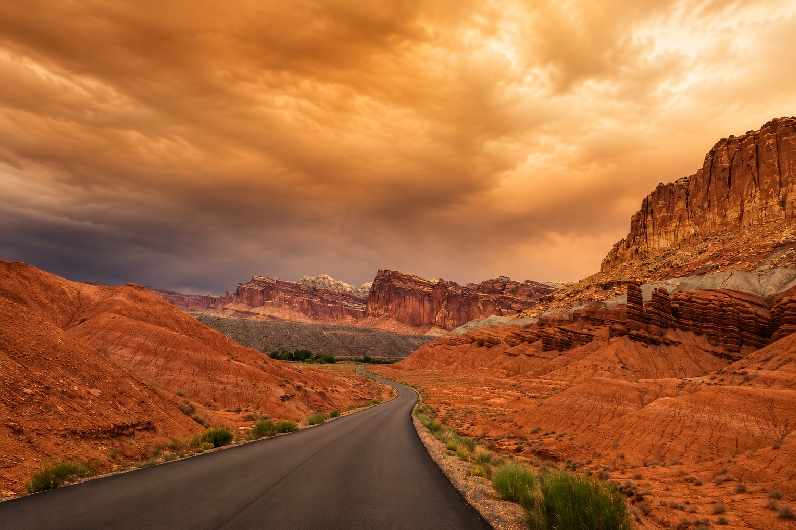 Scenic Drive at Capitol Reef National Park under dramatic wildfire smoke during a summer road trip in Utah.