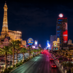 Las Vegas Strip at night with the Paris Las Vegas Eiffel Tower and the Cosmopolitan Hotel